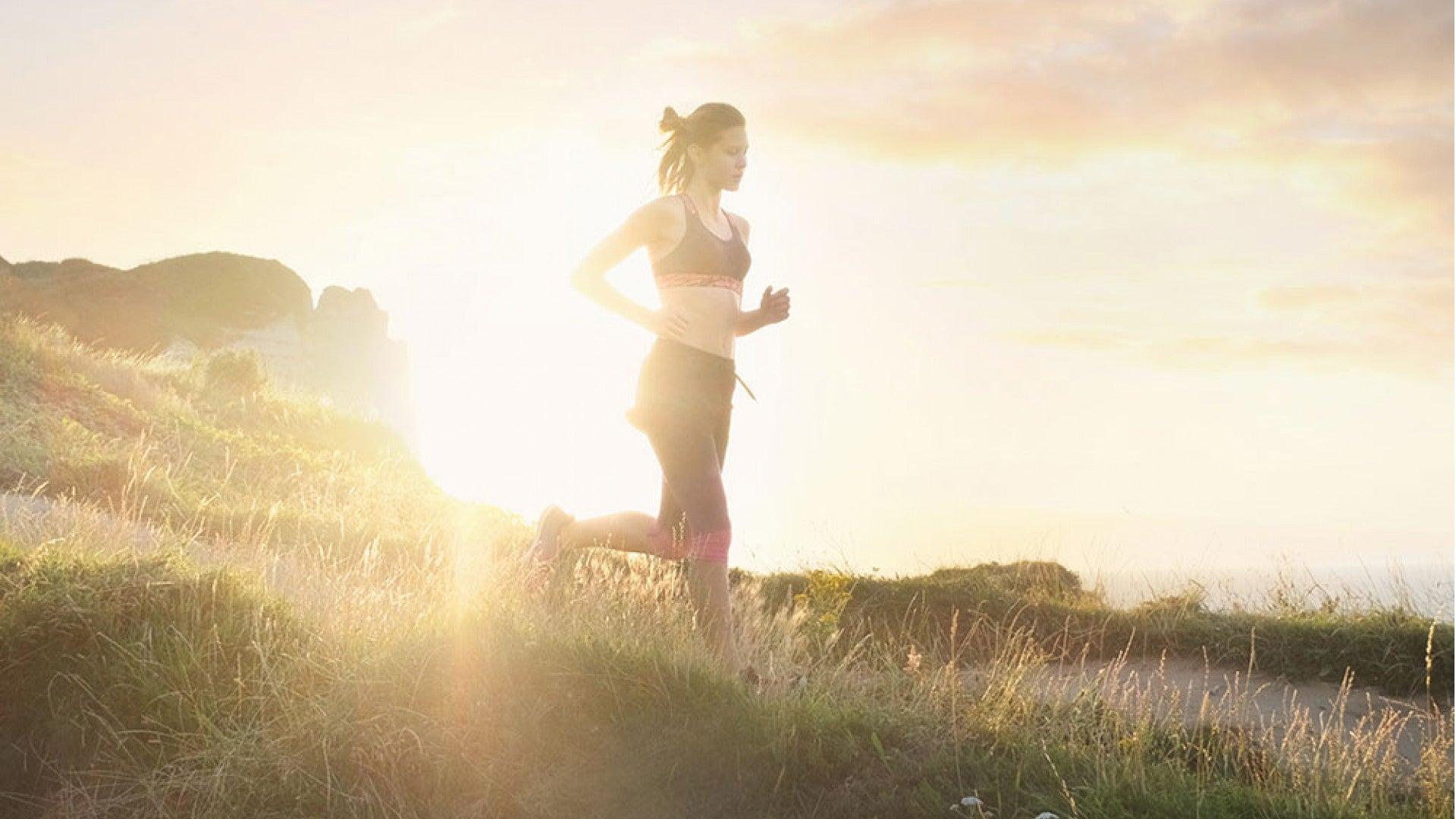 Woman jogging at sunrise in a Nigerian city